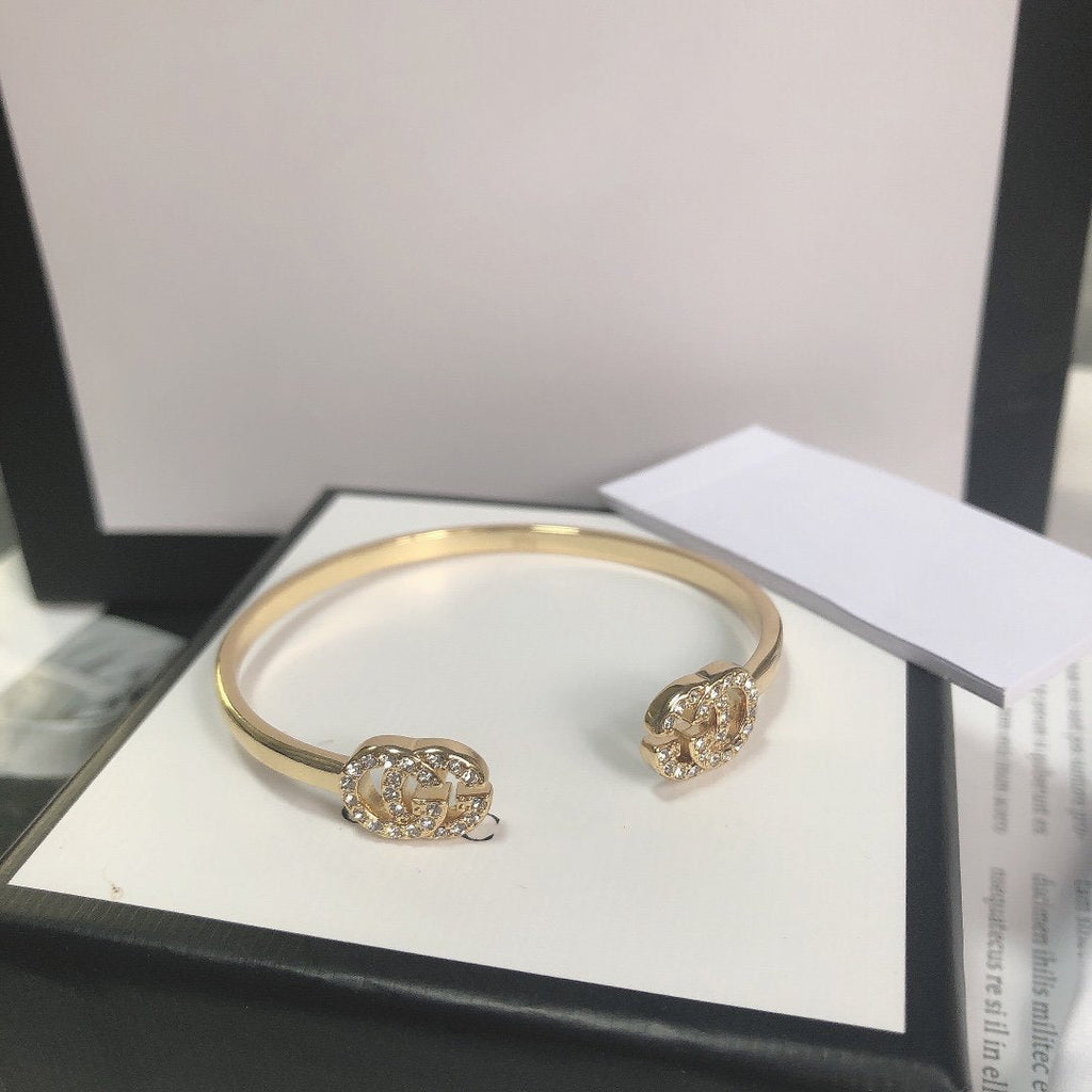 Gucci Gold Running Cubic Zirconia Logo Bangle Bracelets