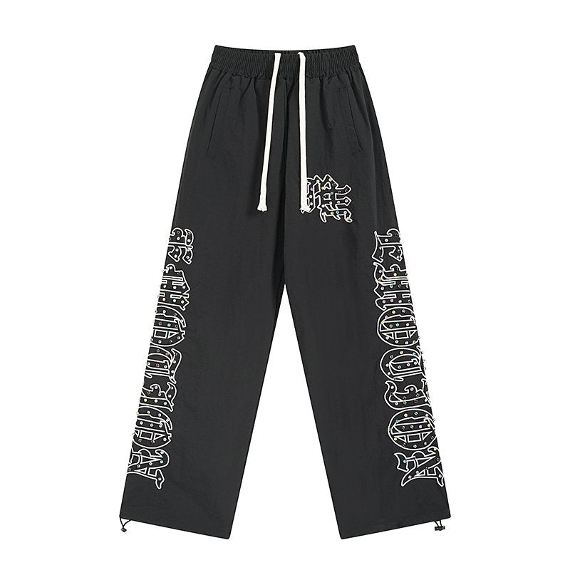 MIXED EMOTION Black Graphic Drawstring Pants — front