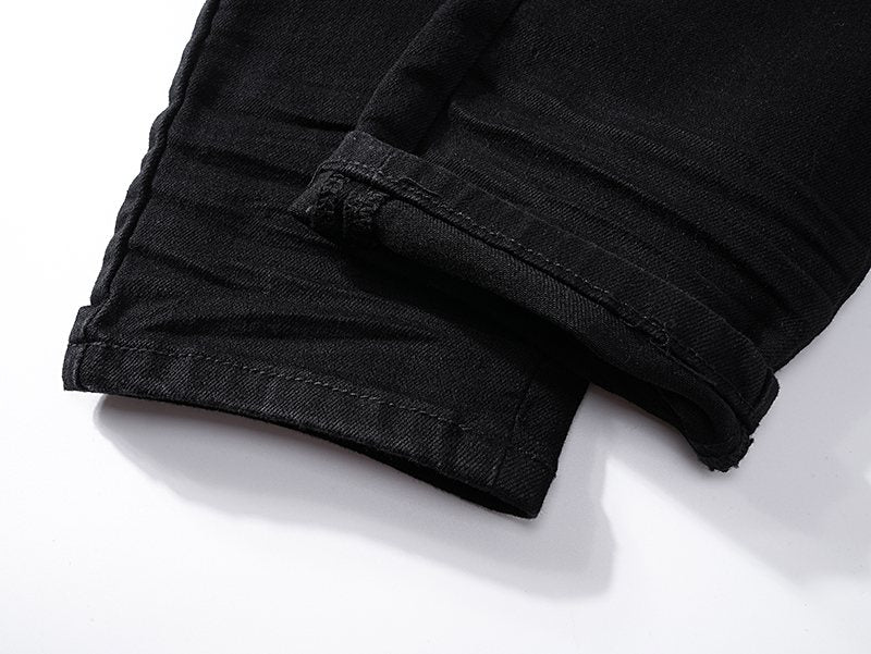 AMIRI Black Distressed Moto Jeans — detail